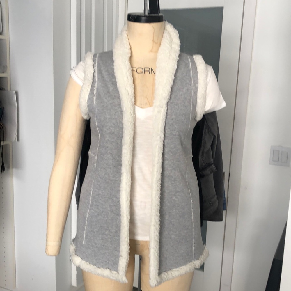 Woman’s Sherpa lined open fleece vest.